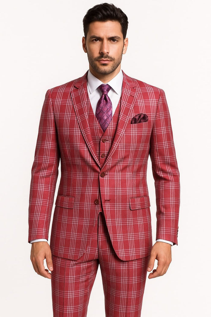 Men's three-piece suit in red plaid. Features a fitted jacket (two-button closure, pockets), vest, and matching pants. Bold red pattern with white/black accents.
