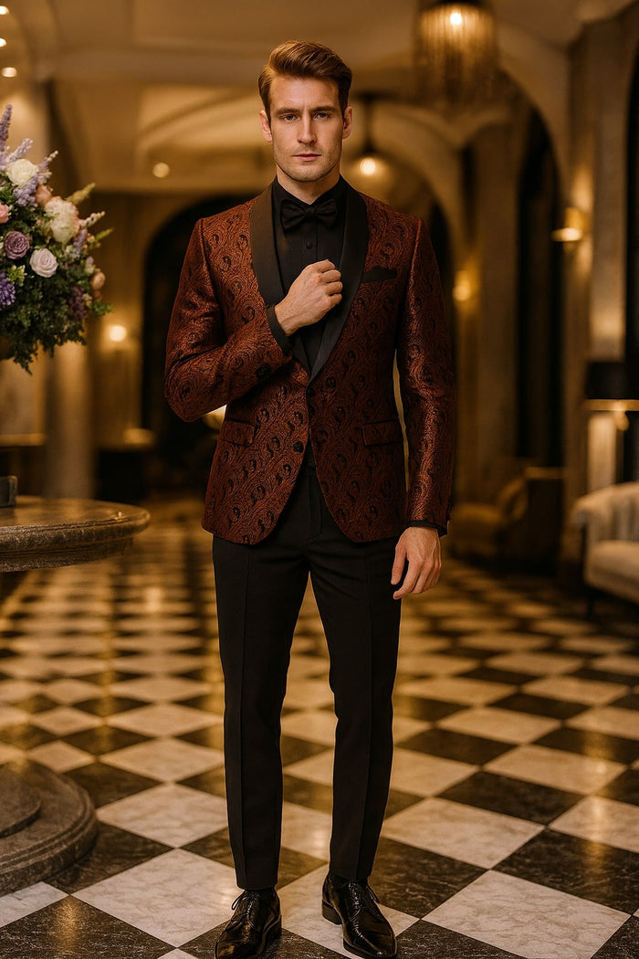 Rust copper paisley tuxedo jacket. Textured fabric, black satin shawl lapel. Includes black trousers and matching bowtie for a sophisticated look.

