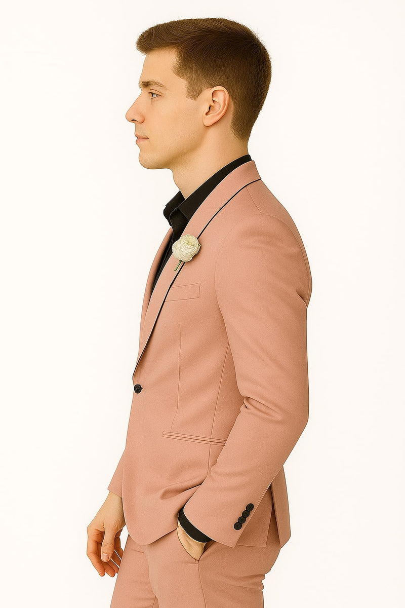 Men's slim fit pink tuxedo. Solid pink fabric, black lapel & pocket trim. Single-breasted jacket, black buttons, smooth finish, straight lines, and a fitted silhouette.
