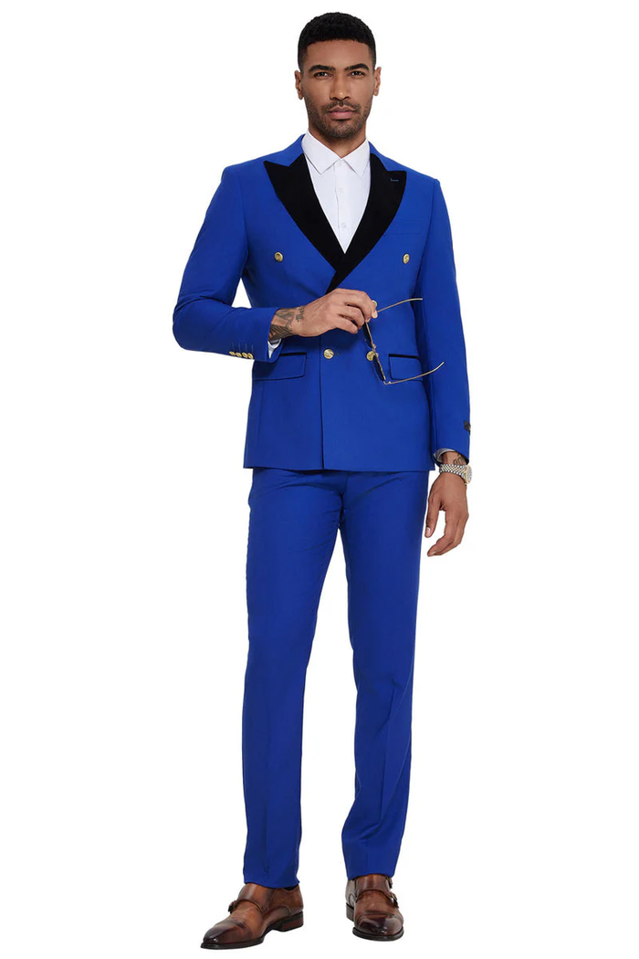 Men's double-breasted wedding suit in vibrant blue with a black velvet peak lapel. Tailored fit, gold buttons, and flat front trousers.
