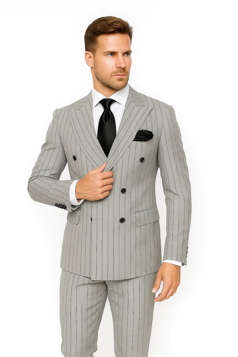 Modern fit gray & black pinstripe double-breasted suit. Textured fabric, peak lapels, and two rows of buttons on the jacket. Slim-fit trousers complete the look.
