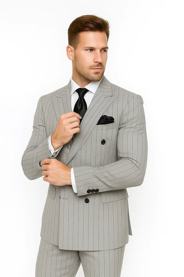Gray & black pinstripe double-breasted suit with a modern, tailored fit. Vertical stripes, structured lapel, two front pockets, smooth fabric, & buttoned cuffs.

