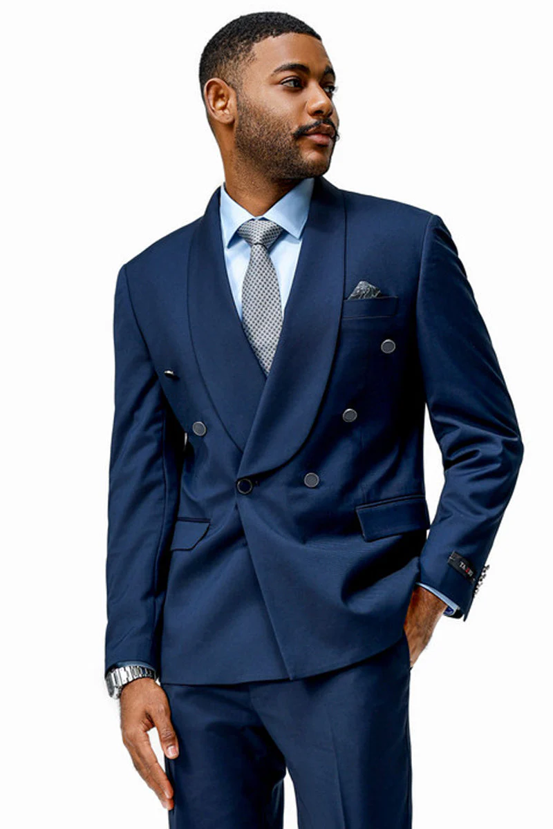 Modern fit navy double-breasted suit. Structured form with fitted silhouette. Features shawl lapel, six-button closure, chest and side pockets. Sleeves with button cuffs. Smooth, predominantly navy fabric.

