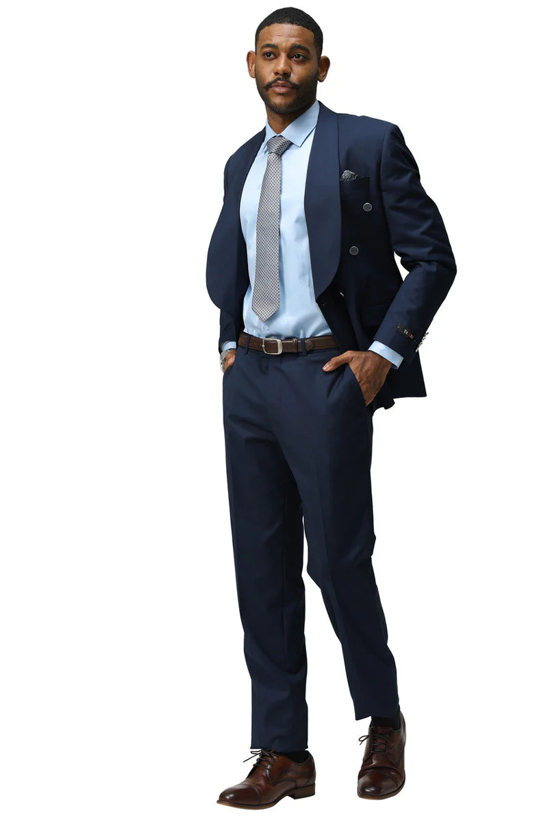 Navy modern fit double-breasted suit with shawl lapel. Structured shape, durable fabric. Includes matching trousers, light blue shirt, patterned tie, and brown shoes.
