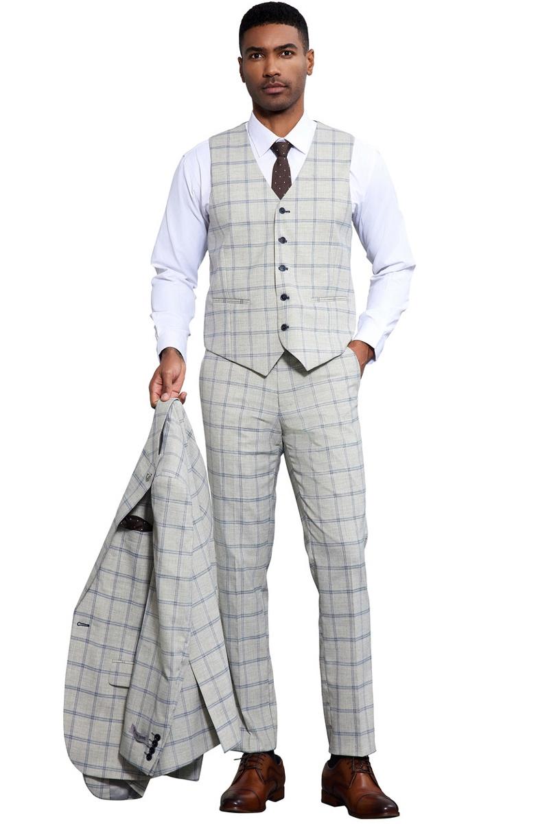 Grey-blue Stacy Adams one-button suit. Windowpane plaid pattern. Peak lapel vest with 5 buttons, notched collar. Slim-fit trousers. Lightweight, woven fabric. Suit jacket in hand.