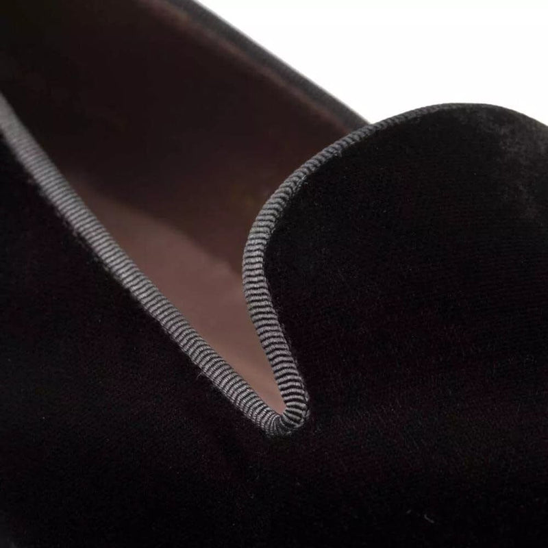 Mezlan Lublin men's formal slip-on. Black, rich velvet upper with a smooth texture. Loafer design with a slightly curved opening and striped trim.
