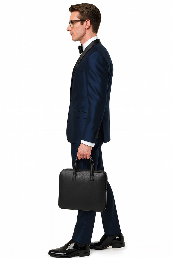 Men's light navy satin tuxedo with black shawl lapel. Three-piece design paired with a white dress shirt and black bow tie.
