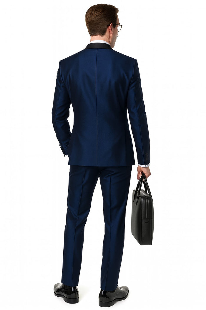 Navy satin tuxedo for men with black shawl lapel. Three-piece design with structured form and tailored trousers.
