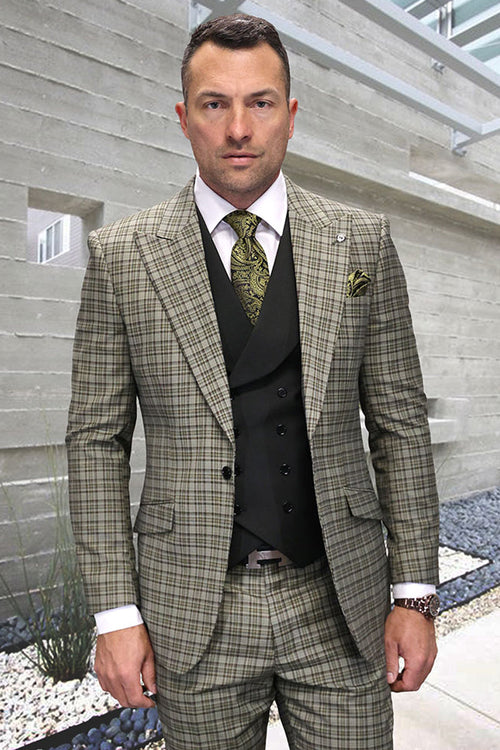 Olive green windowpane plaid wool suit for men. Tailored jacket with peak lapels, fitted silhouette, and structured shoulders. Black vest layered beneath. White shirt, patterned tie. Includes jacket, vest and trousers. Formal attire.
