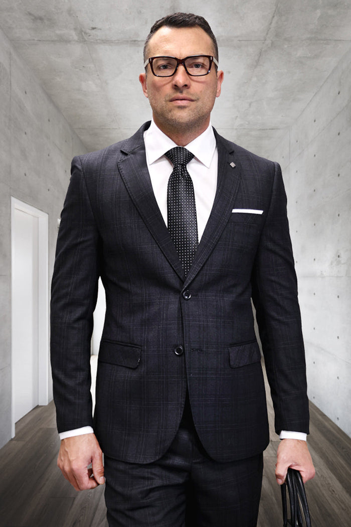 Modern fit men's Italian wool suit in black plaid. Tailored silhouette, single-breasted jacket, notch lapels. Wool blend with gray accents. Includes matching straight-leg trousers.
