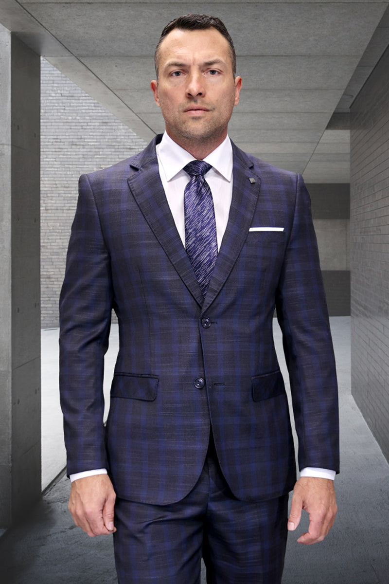 Modern fit men's Italian wool suit in heather charcoal plaid. Tailored silhouette, structured shoulders, single-button closure. Features subtle charcoal/dark blue plaid, notch lapel, chest pocket, and straight-leg trousers.
