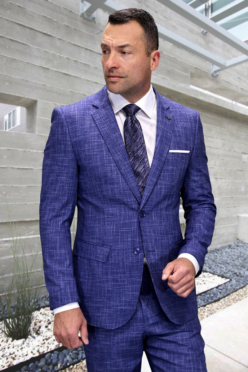 Men's modern fit suit in sapphire blue plaid. Italian wool, textured weave. Single-button jacket with notched lapel & two pockets. Tailored trousers. Contemporary silhouette.
