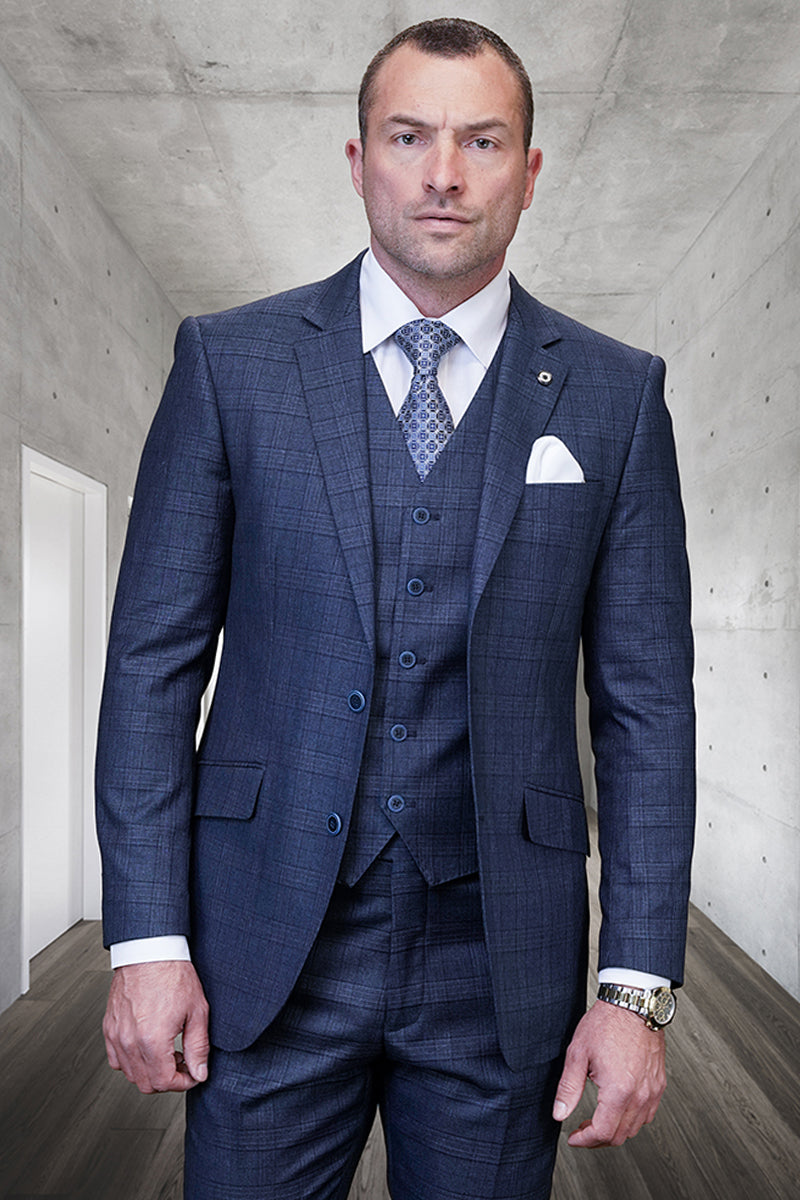 Men's indigo blue plaid wool suit. Features a tailored two-button blazer with notched lapels, matching vest, and trousers. Textured wool with a check pattern, blue buttons, and a visible white pocket square.

