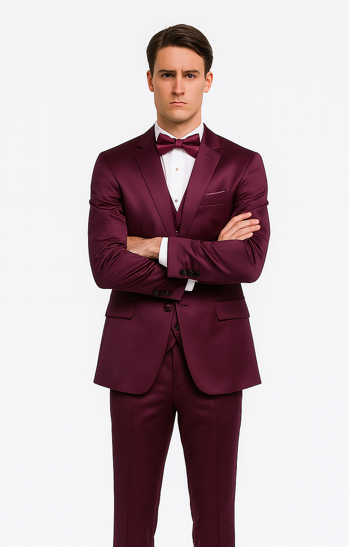 Purple satin three-piece men's suit: slim fit, peak lapel, double-breasted. Deep purple color. Includes matching bow tie, pocket square. Jacket: two side pockets, single breast pocket. Streamlined trousers.

