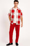 Red & white checkered short-sleeve shirt with a classic collar & button front. Paired with solid red pants. Casual, coordinated summer outfit. Lightweight, breathable fabric.
