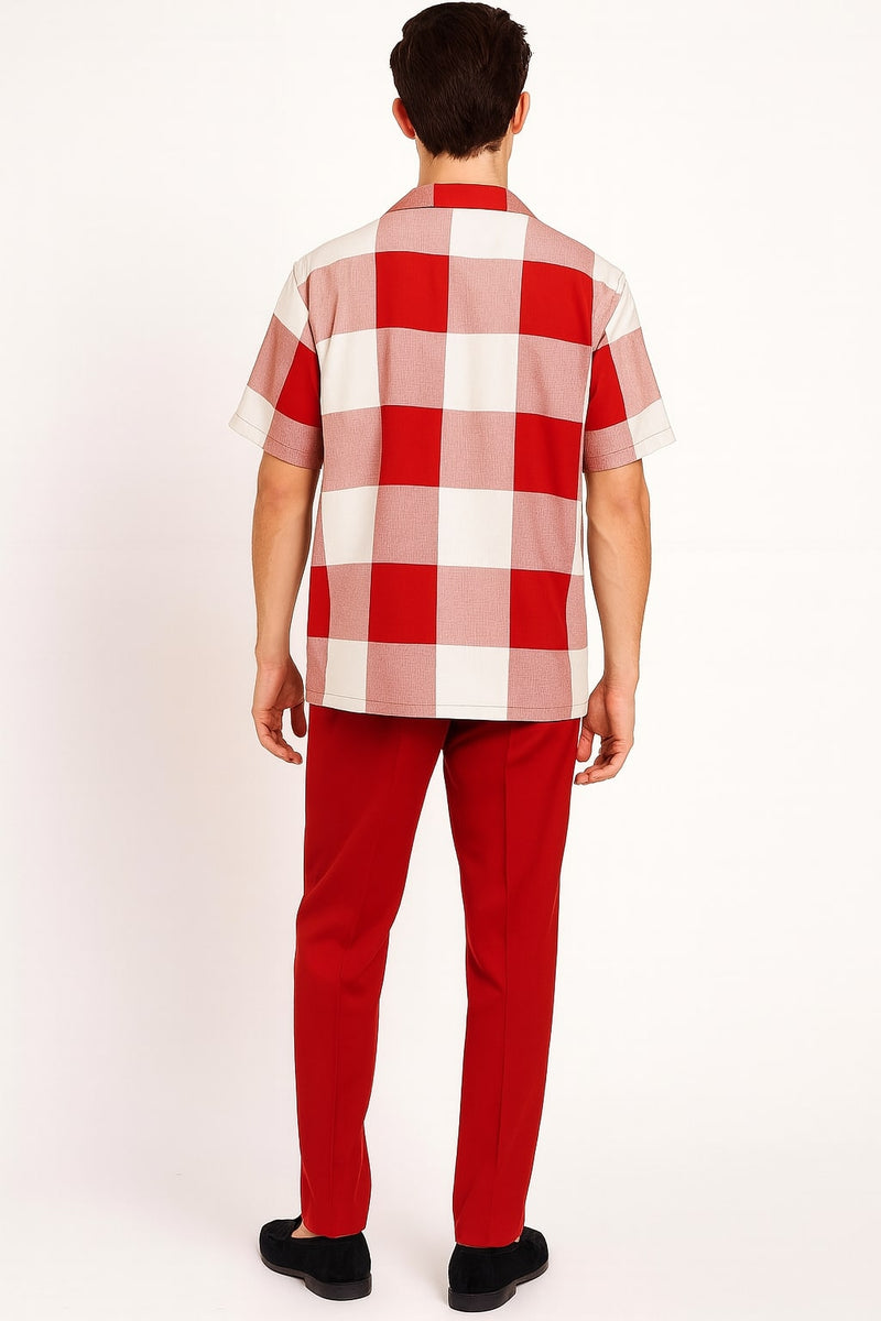 Red and white checkered short-sleeve shirt with boxy fit and spread collar. Features large squares in vibrant red and white. Paired with solid red pants for a cohesive look.
