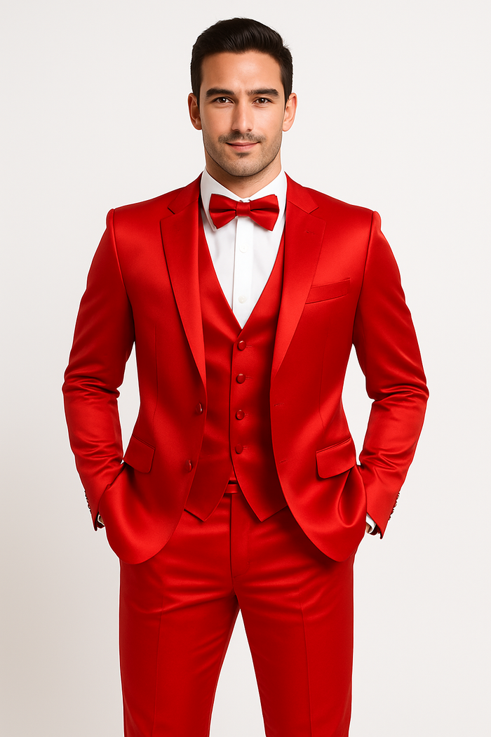 Red tuxedo set: jacket, vest, trousers, and bow tie. Bright red satin fabric. Single-breasted jacket with lapels, matching vest, tailored straight-leg trousers. Classic formal wear.
