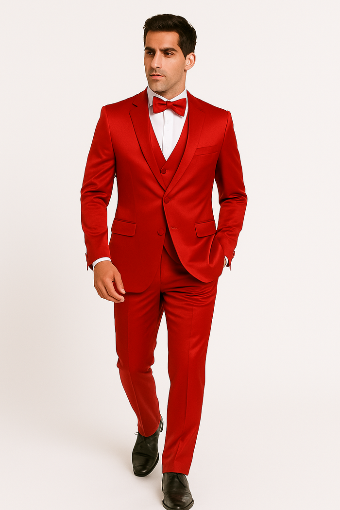 Alberto Nardoni's Red Majesty tuxedo: fitted bright red jacket, single-button closure, slim red trousers. Includes white shirt & red bow tie. Smooth, shiny formal fabric.
