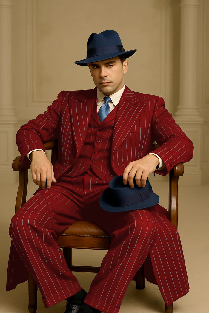 Men's red pinstripe suit. Classic long coat style with white stripes, tailored three-piece design (vest, pants, coat). Vertical stripes enhance length. Blended fabric (wool-like). Cohesive look.
