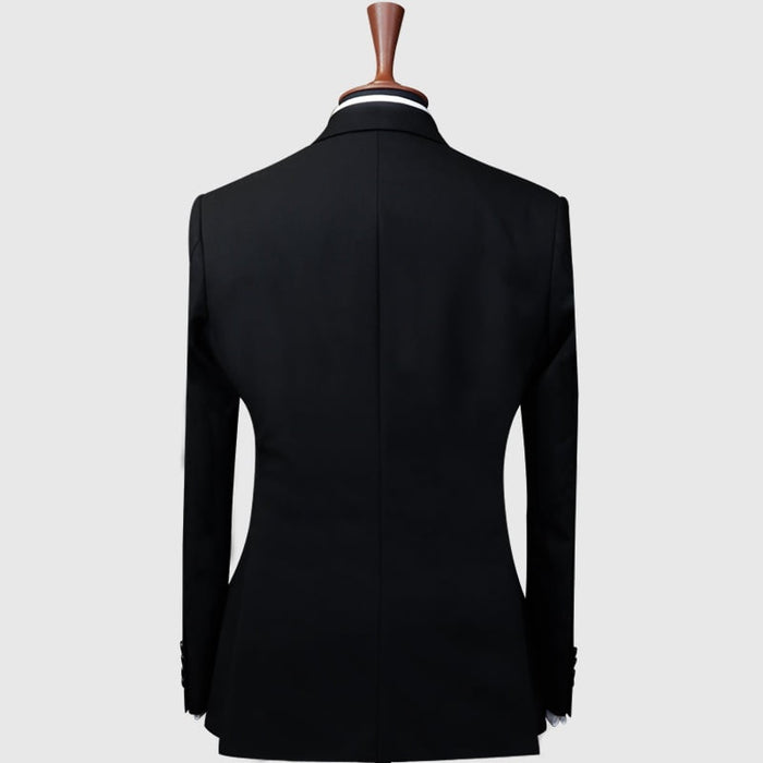 Black suit jacket with a fitted silhouette and structured shoulders, featuring a single vent at the back. The fabric appears smooth and possibly made from a wool blend. The collar is notch-style, complementing the jacket's formal design.