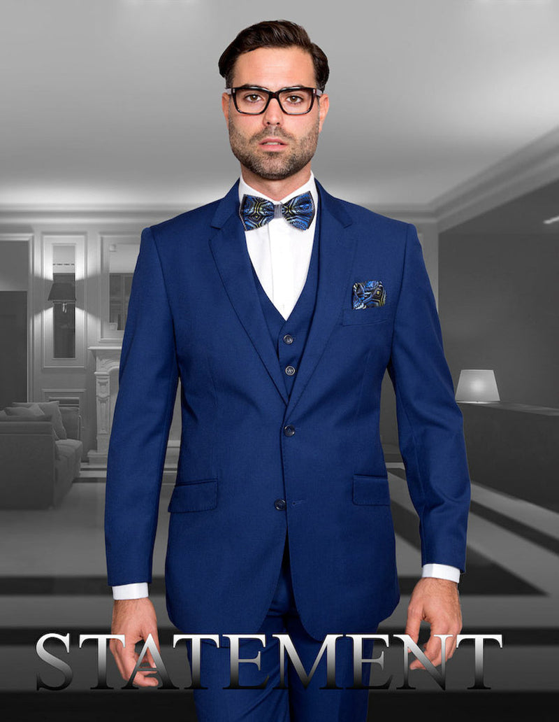 Men's Sapphire Blue wool suit with a modern fit. Includes a 2-button jacket, vest, and notch lapels. Features a solid color, two front pockets, and is crafted from wool.