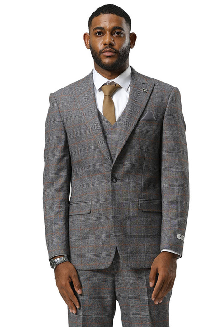 Stacy Adams men's grey glen plaid suit with peak lapels. Includes a double-breasted vest. Fabric has subtle orange & blue lines. Tailored jacket, structured fit, and flap pockets.
