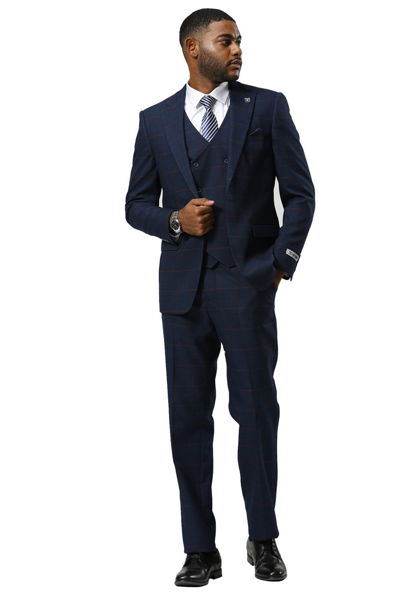Navy glen plaid Stacy Adams suit with red accents. Includes a double-breasted vest and tailored fit pants. Features peak lapels, structured shoulders, and a one-button closure for a streamlined look.
