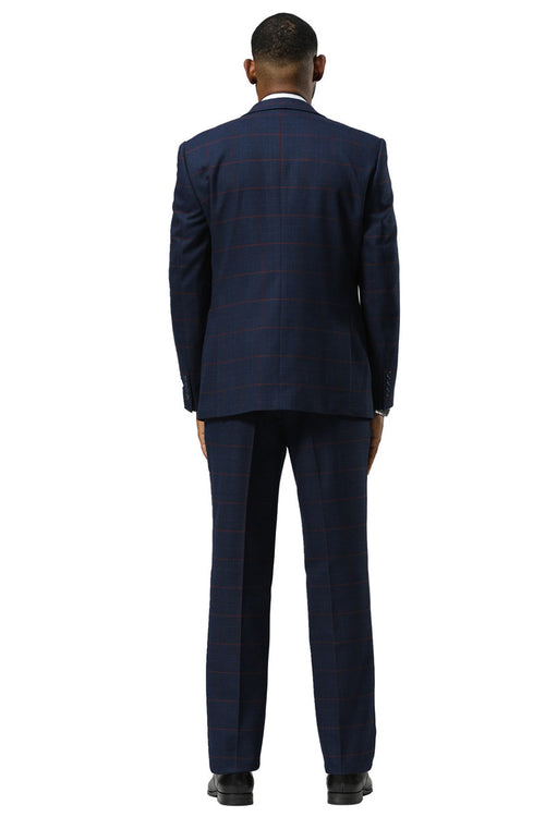 Navy glen plaid suit: one-button peak lapel jacket, structured fit, flat-front trousers. Navy/red check pattern. Single vent jacket, double-breasted vest. Classic, tailored look.

