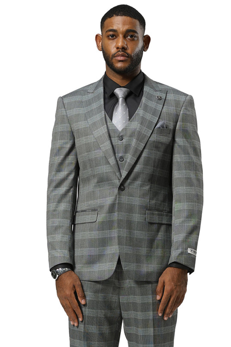 Men's Stacy Adams grey glen plaid one-button suit. Peak lapel jacket, matching vest, and tailored trousers. Features a structured, smooth fabric with a contrasting plaid pattern. Styled with a dress shirt and tie.
