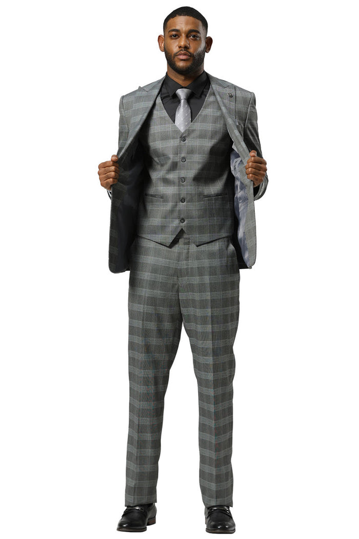 Stacy Adams men's grey glen plaid one-button vested suit with peak lapel. Features matching trousers and a vested jacket with a single button closure. Checkered design with light & dark grey squares & subtle blue accents. Lined interior.
