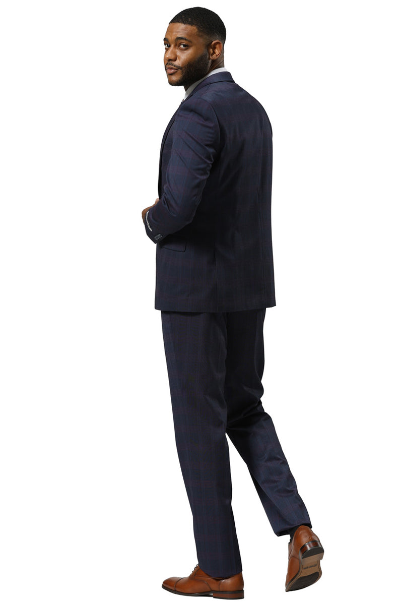 Men's Stacy Adams suit: Navy glen plaid with peak lapel. Single-button blazer & tailored trousers create a structured, formal silhouette. Dark blue/red accents.
