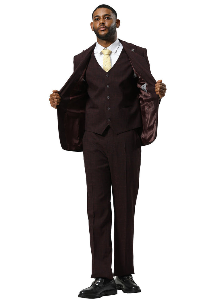 Stacy Adams burgundy sharkskin suit: single-button, peak lapel jacket, fitted vest with 3 buttons, and matching trousers. Textured fabric, contrasting lining. Stylish and coordinated.