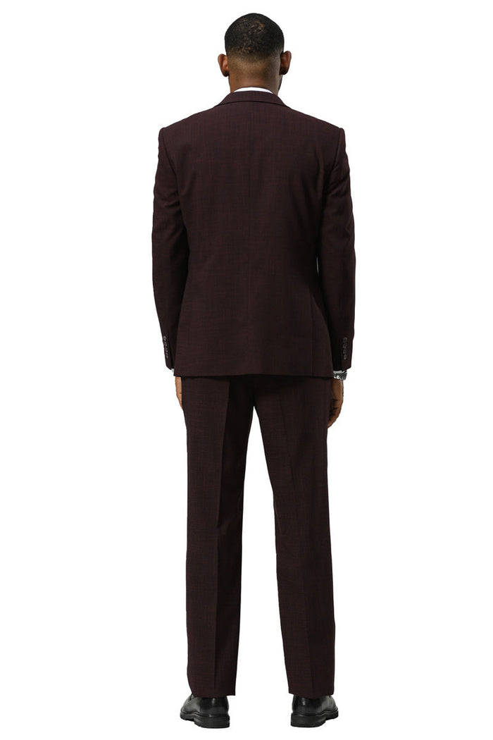 Burgundy Stacy Adams sharkskin suit: One-button peak lapel vest, slim-fit jacket. Subtle texture. Straight leg pants. Cohesive, formal look.
