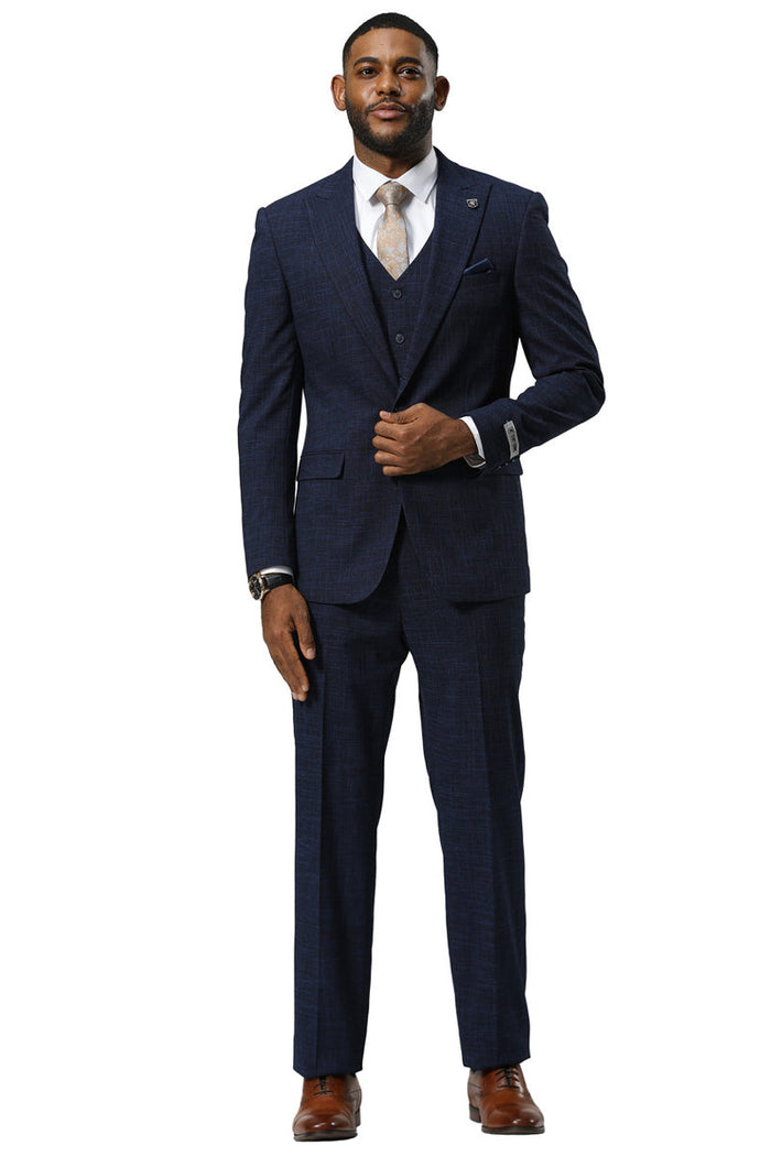 Navy sharkskin suit by Stacy Adams. One-button jacket with peak lapels, vest, and matching trousers. Textured pattern for a formal men's look.
