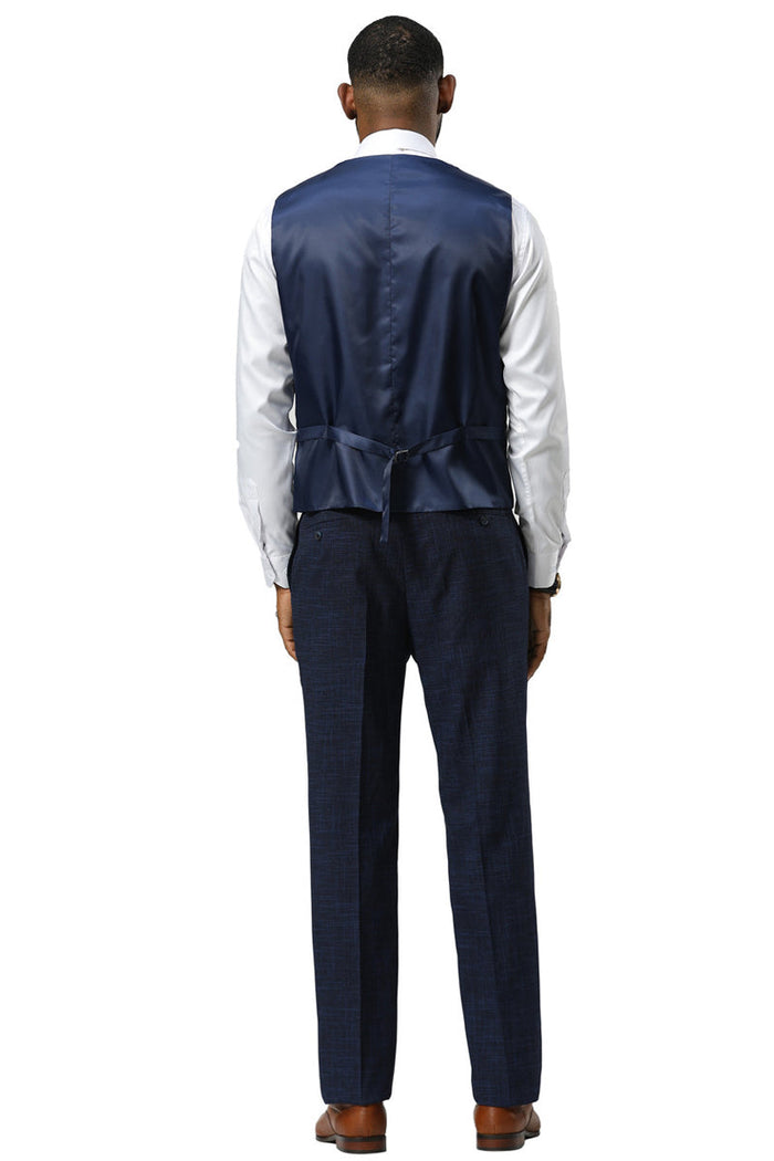Navy Stacy Adams sharkskin suit: one-button peak lapel vest, matching trousers. Vest: smooth, shiny navy. Pants: textured, darker navy. Fitted shape, vest with back tie.
