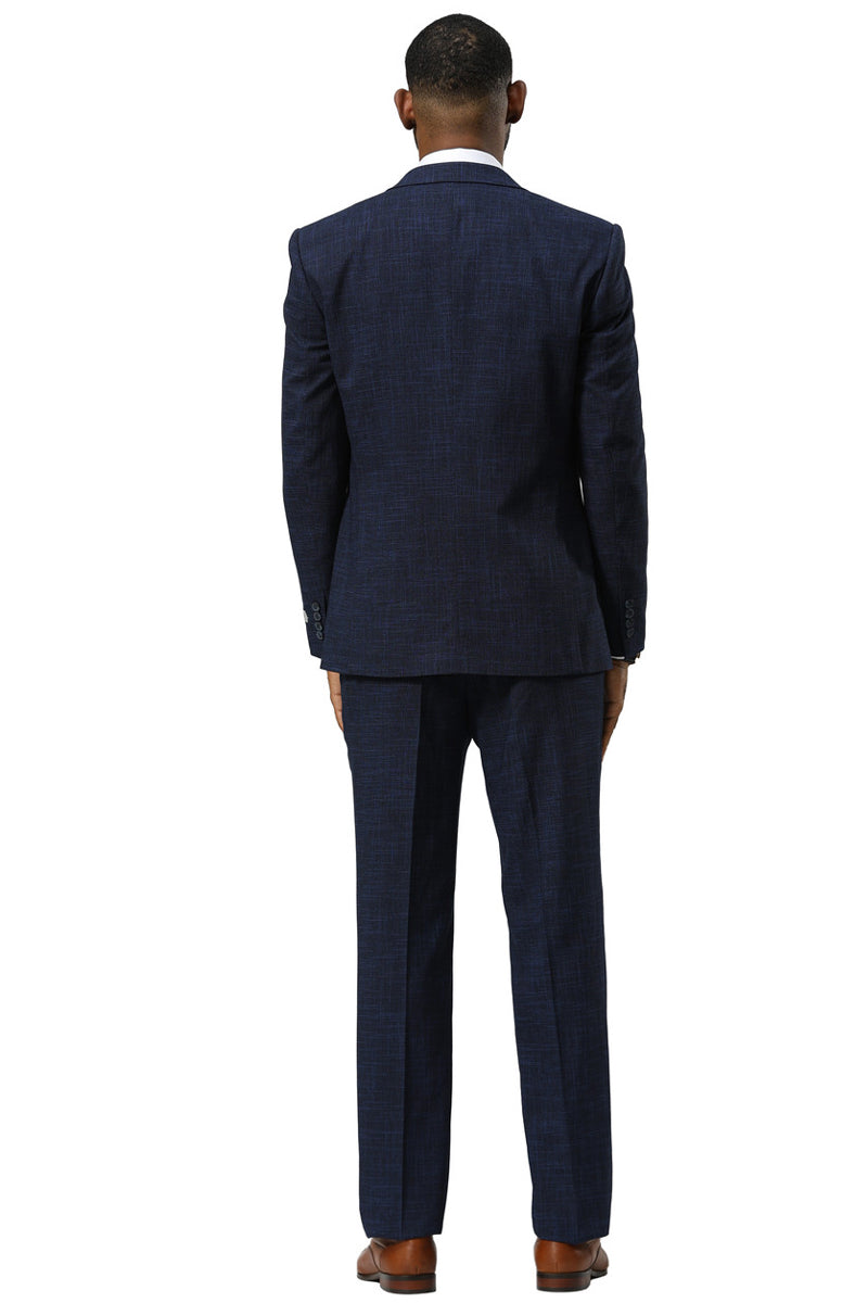Navy Stacy Adams sharkskin suit. One-button peak lapel with a textured pattern. Fitted design, dark navy fabric. Includes a vest, tailored, and features straight-cut trousers. Structured appearance.
