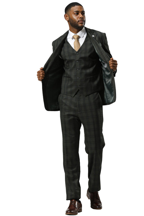 Stacy Adams modern fit hunter green vested suit. Double windowpane plaid. Structured jacket, matching vest & trousers. Formal material blend. Visible stitching. Brown shoes complete the look.
