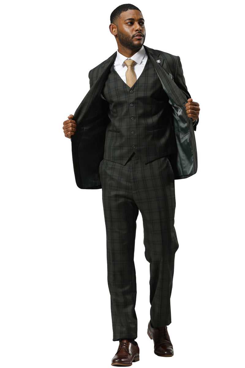 Stacy Adams modern fit hunter green vested suit. Double windowpane plaid. Structured jacket, matching vest & trousers. Formal material blend. Visible stitching. Brown shoes complete the look.
