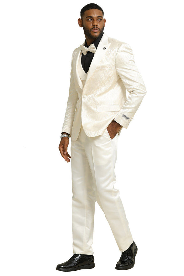 Ivory men's tuxedo with shiny brocade, double-breasted vest. Includes black shirt, bow tie. Slim fit tailcoat jacket, matching smooth trousers. Formal elegance.
