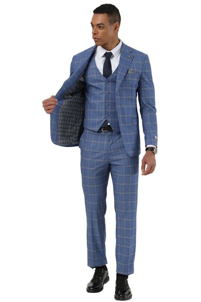 Blue Stacy Adams glen plaid suit. Fitted, three-button blazer with notch lapels, matching vest and straight-cut trousers. Contrasting plaid pattern. Blazer lined with patterned fabric. Includes white shirt and navy tie.
