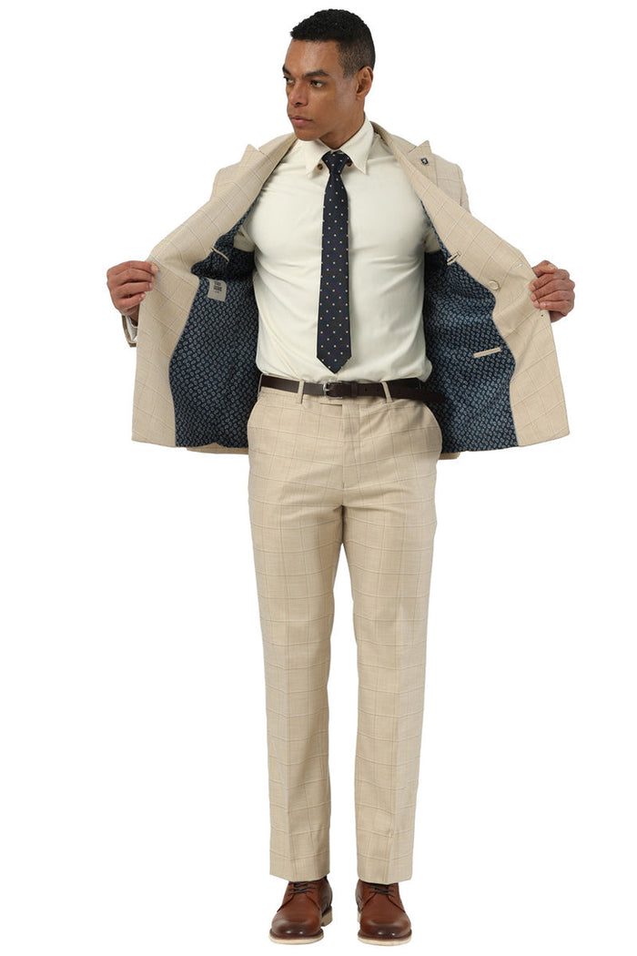 Men's Stacy Adams beige summer suit with windowpane plaid. Double-breasted jacket, notch lapel. Navy lining. Tapered trousers, matching plaid. Structured silhouette.
