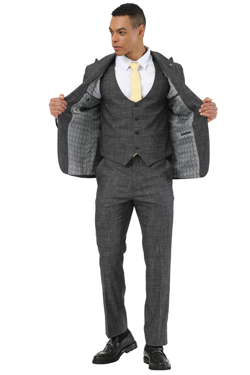 Men's Stacy Adams sharkskin suit: black with windowpane pattern. One-button peak lapel jacket & matching vest. Slim fit trousers. Dark grey with subtle contrasting lines. Patterned lining.
