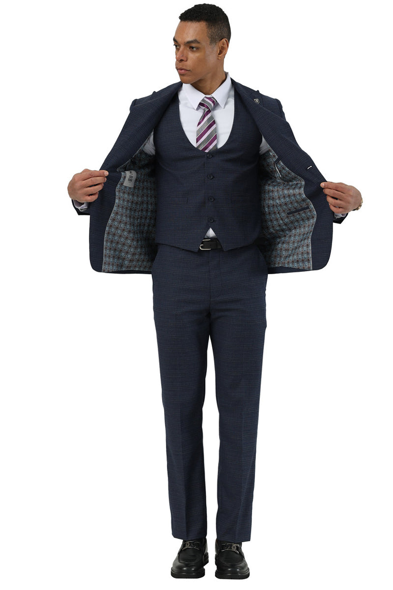 Navy glen plaid two-button suit by Stacy Adams. Peak lapels, open jacket with lined interior. Includes a matching scoop vest and tailored trousers for a structured fit.
