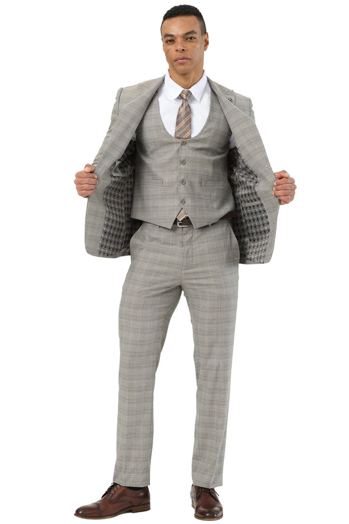 Khaki glen plaid Stacy Adams men's suit. Two-button, peak lapel, and a matching scoop vest. Features a fitted silhouette and contrasting interior lining.
