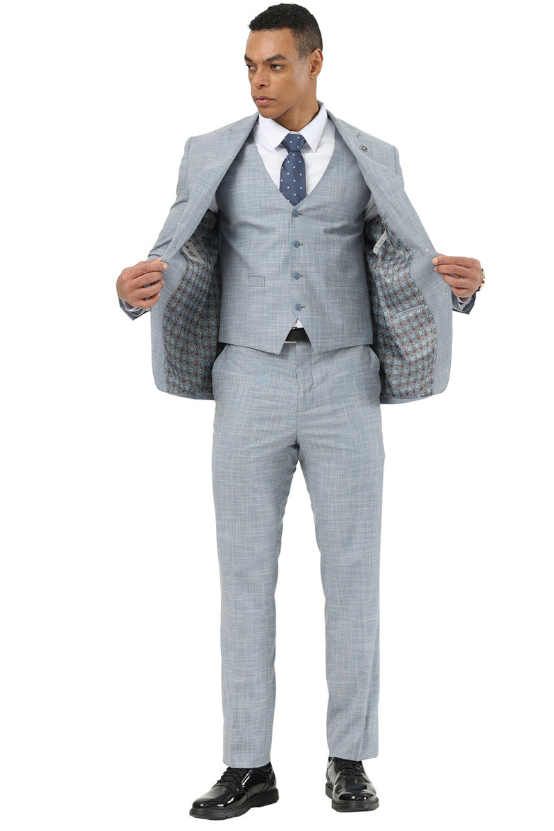 Stacy Adams light grey sharkskin suit. Features a 2-button blazer with notch lapels, fitted shape. Matching vest (5-button). Straight-cut trousers. Contrasting patterned jacket lining.