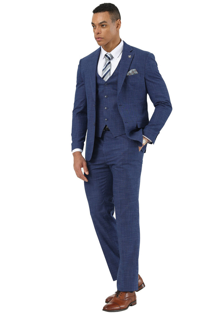 Stacy Adams men's indigo blue vested suit. Three-piece sharkskin weave: jacket with notched lapel, button vest, straight-leg trousers. Subtle textured pattern. Includes shirt and striped tie.
