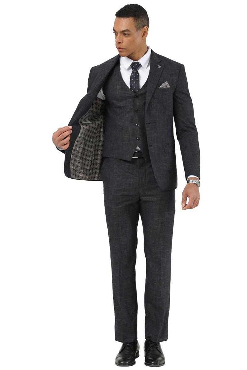 Stacy Adams men's black sharkskin suit: three-piece, fitted vest, single-breasted jacket, straight-leg trousers. Subtle sheen, textured pattern, contrasting lining. Standard lapels, structured fit.
