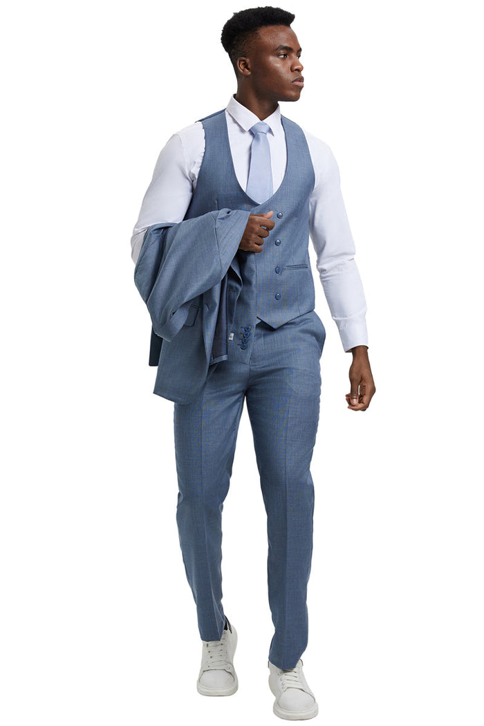 Stacy Adams men's two-button vested suit in light steel blue with subtle pattern. Features a fitted vest, slim-fit trousers and a notched lapel. Made from smooth, sharkskin-like fabric with a slight sheen.
