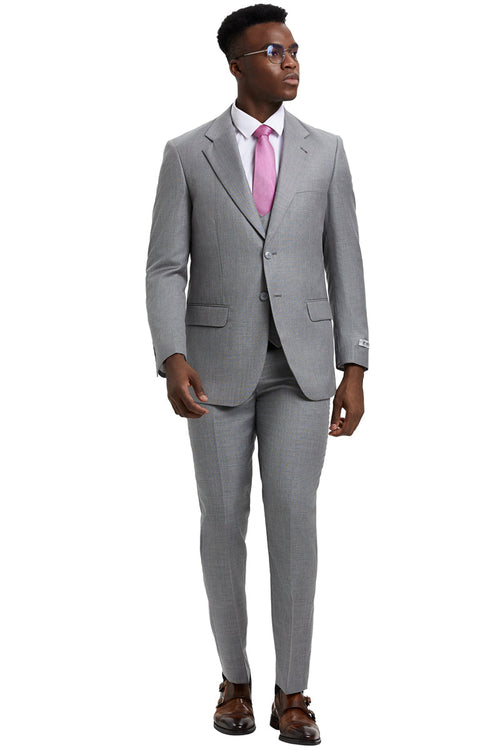 Men's Stacy Adams light grey sharkskin suit. Two-button blazer with notched lapel, matching vest, and slim-fit trousers. Smooth fabric with subtle sheen, three-piece design. Light grey color.
