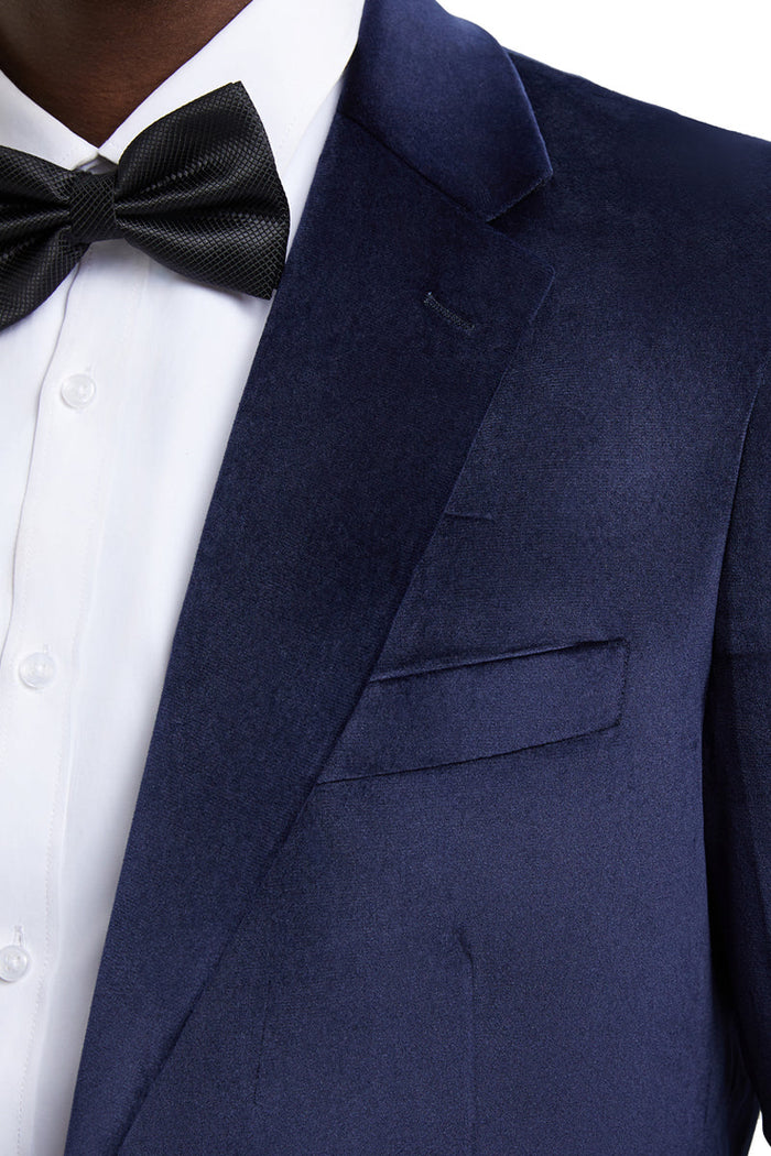 Navy velvet blazer by Stacy Adams. Modern fit with a smooth, lustrous texture. Single-breasted, notch lapels, and two front pockets. Tailored for a structured silhouette.
